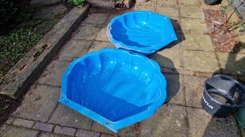 Blauwe schelp zandbak
