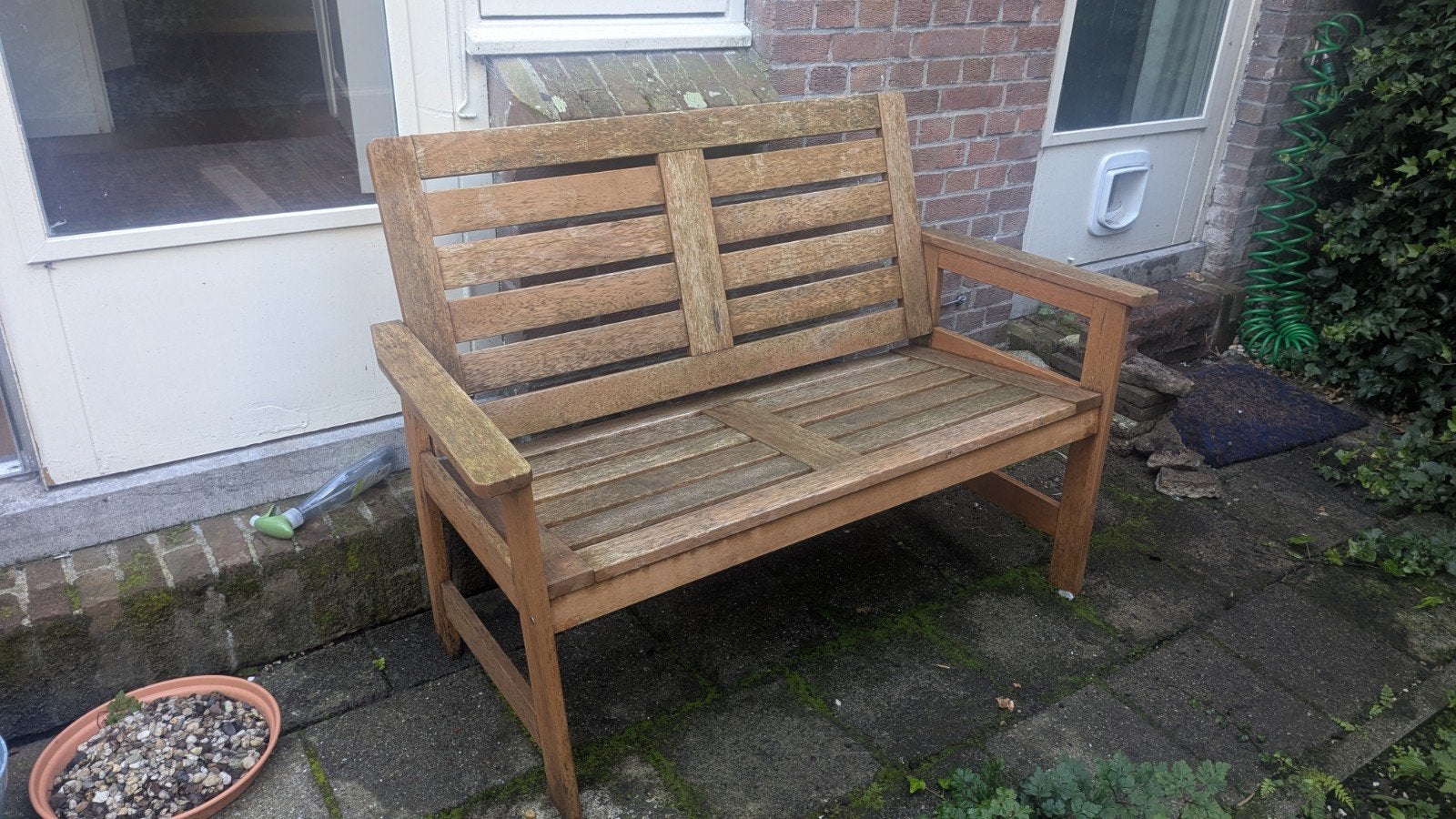 Sturdy wooden garden bench for two people. The bench is used
