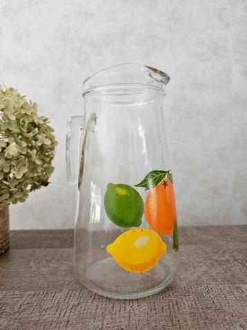 Vintage glazen sap / waterkan met citrusvruchten 
