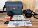 A1393. Nikon F50 analoge camera met lenzen en tas/boekje
