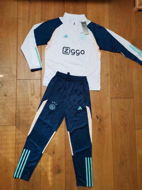 Adidas Ajax trainingspak wit blauw turquoise 140?, Kinderen en Baby's, Kinderkleding | Maat 140, Nieuw, Jongen of Meisje, Sport- of Zwemkleding