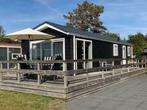 Te huur/te koop ruim Arcabo chalet aan strand Lauwersmeer, Vakantie, 2 slaapkamers, Aan zee, Tuin, Groningen