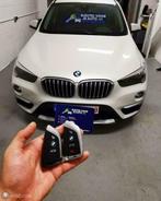 Bmw autosleutel bijmaken kopiëren in leren slijpen sleutel