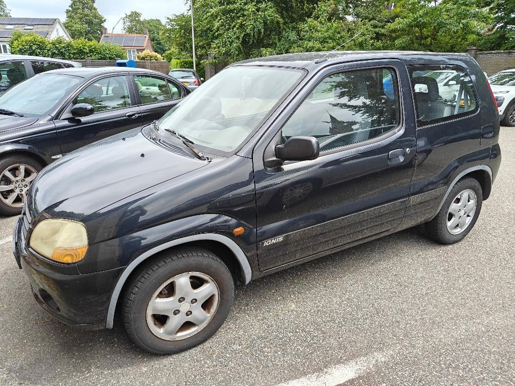 Suzuki Ignis 1.3 GL 2003 Zwart, APK Sep 2026 (zwakke accu), Auto's, Voorwielaandrijving, Stof, 31 €/maand, Ignis
