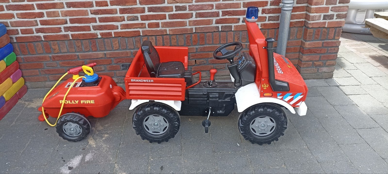 Rolly Toys Unimog Brandweer met aanhangwagen en spuit, Ophalen, Zo goed als nieuw, Trapvoertuig