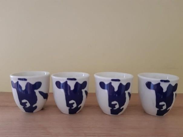 Friesland Campina eierdopjes met koeienprint, Huis en Inrichting, Keuken | Servies, Overige typen, Ophalen of Verzenden, Zo goed als nieuw