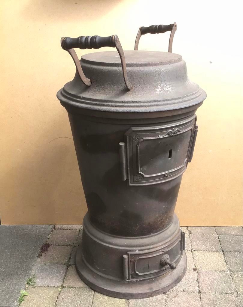Oude gietijzeren kolenkachel, Dru, Ophalen