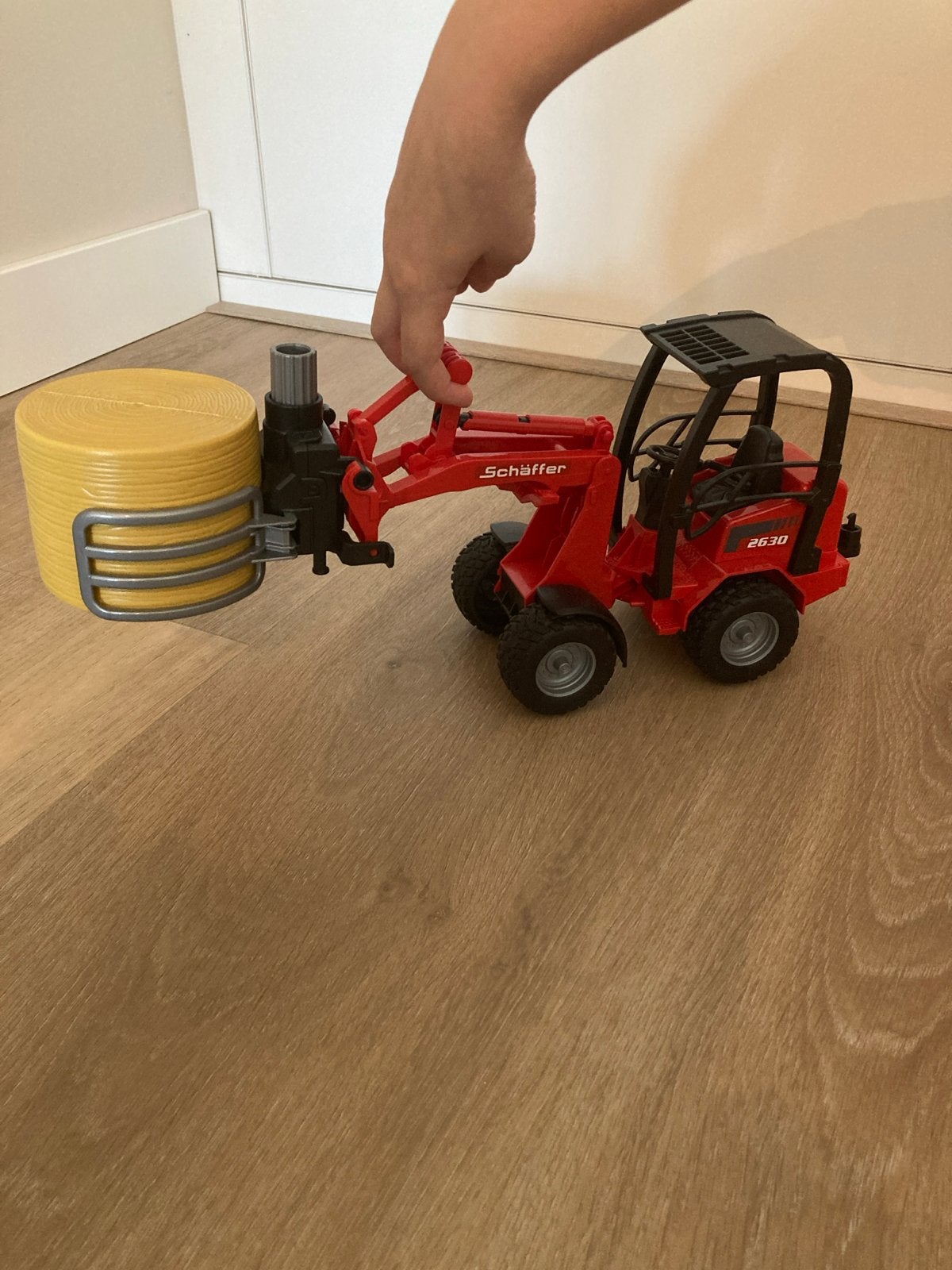 Bruder Schäffer 2630 met baal en bak, Ophalen, Gebruikt