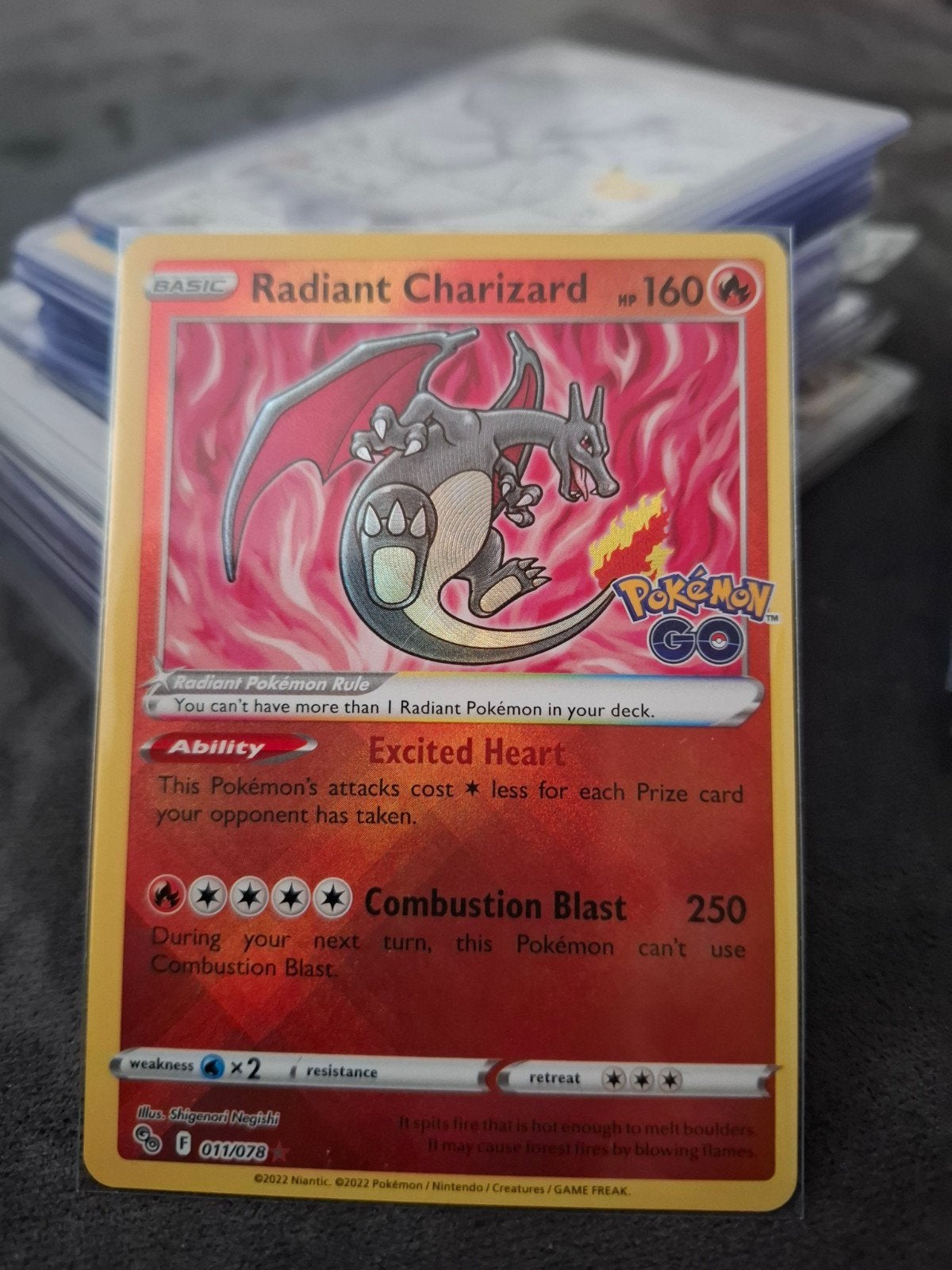 Radiant Charizard (011/078) - Pokémon GO, Ophalen of Verzenden, Zo goed als nieuw, Losse kaart, Foil