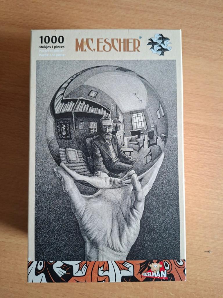 M.C. Escher Hand met Bol Puzzel - 1000 stukjes, Ophalen of Verzenden, 500 t/m 1500 stukjes, Zo goed als nieuw, Legpuzzel