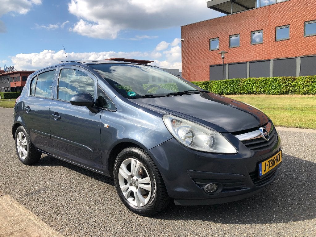Opel Corsa 1.2 16V 5D WR 2007 navi , pano dak , airco , !!!, Voorwielaandrijving, Euro 5, Stof, Zwart