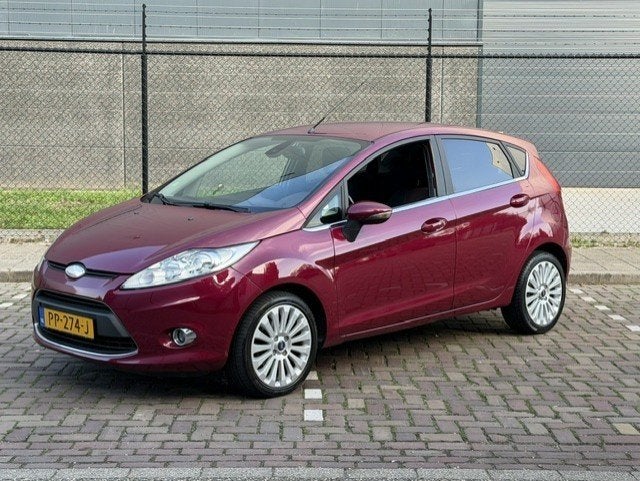 Ford Fiësta 1.25 Ghia 82PK 5DRS 2009 Airco Stoelverwarming, Voorwielaandrijving, Stof, 1242 cc, 82 pk