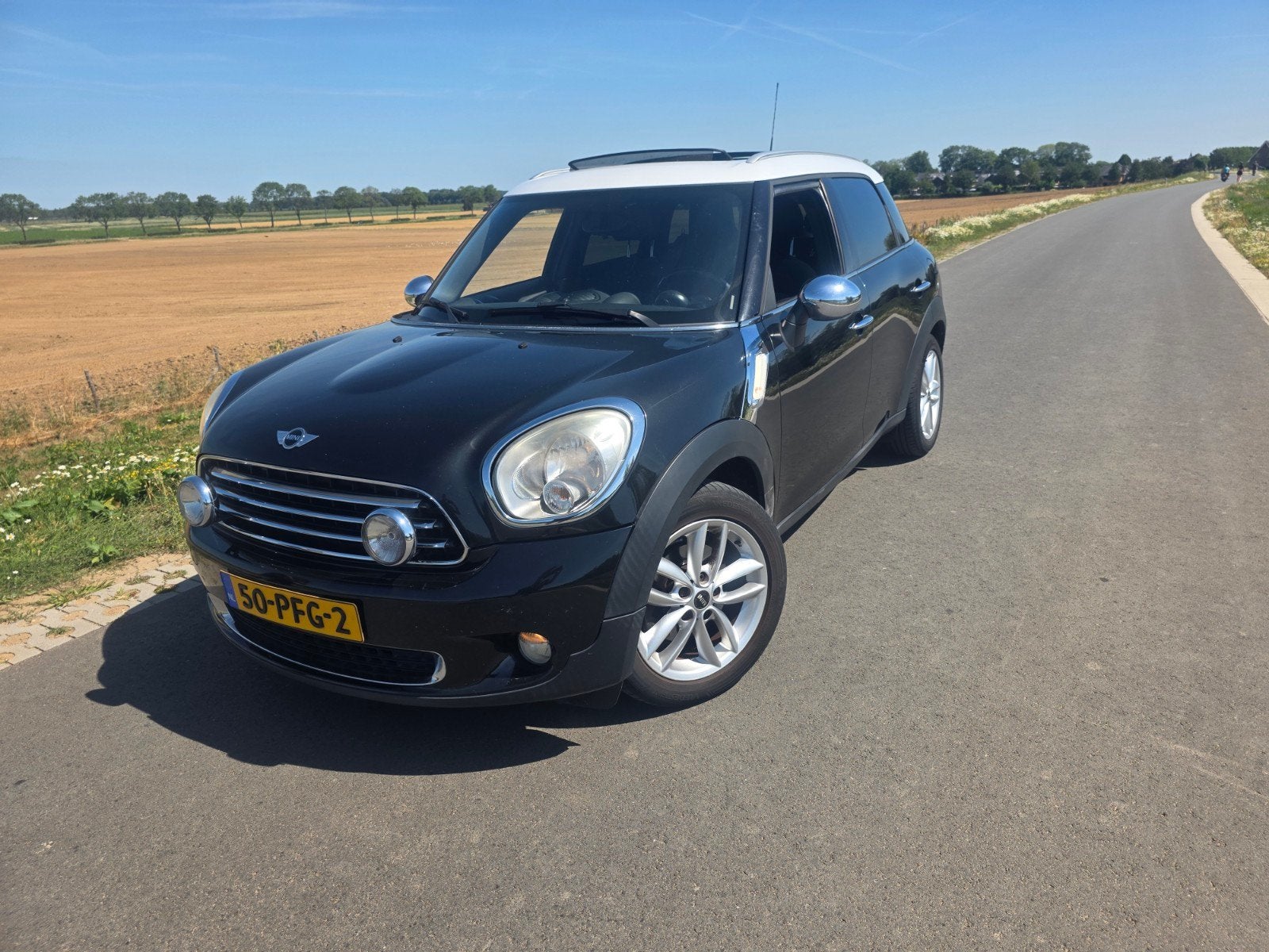 Mini Countryman 1.6 Cooper 2011 Zwart, Voorwielaandrijving, Zwart, Leder en Stof, Origineel Nederlands
