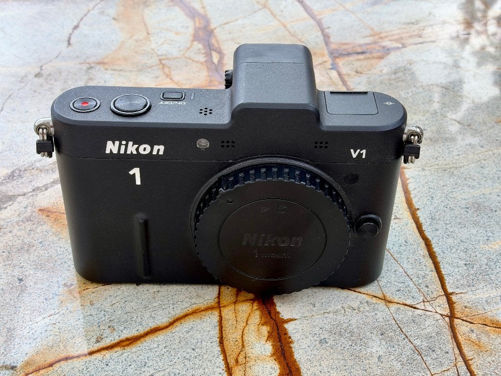 Nikon 1  V1 J5 En div.!, Accu, Ophalen of Verzenden, Zo goed als nieuw, Nikon