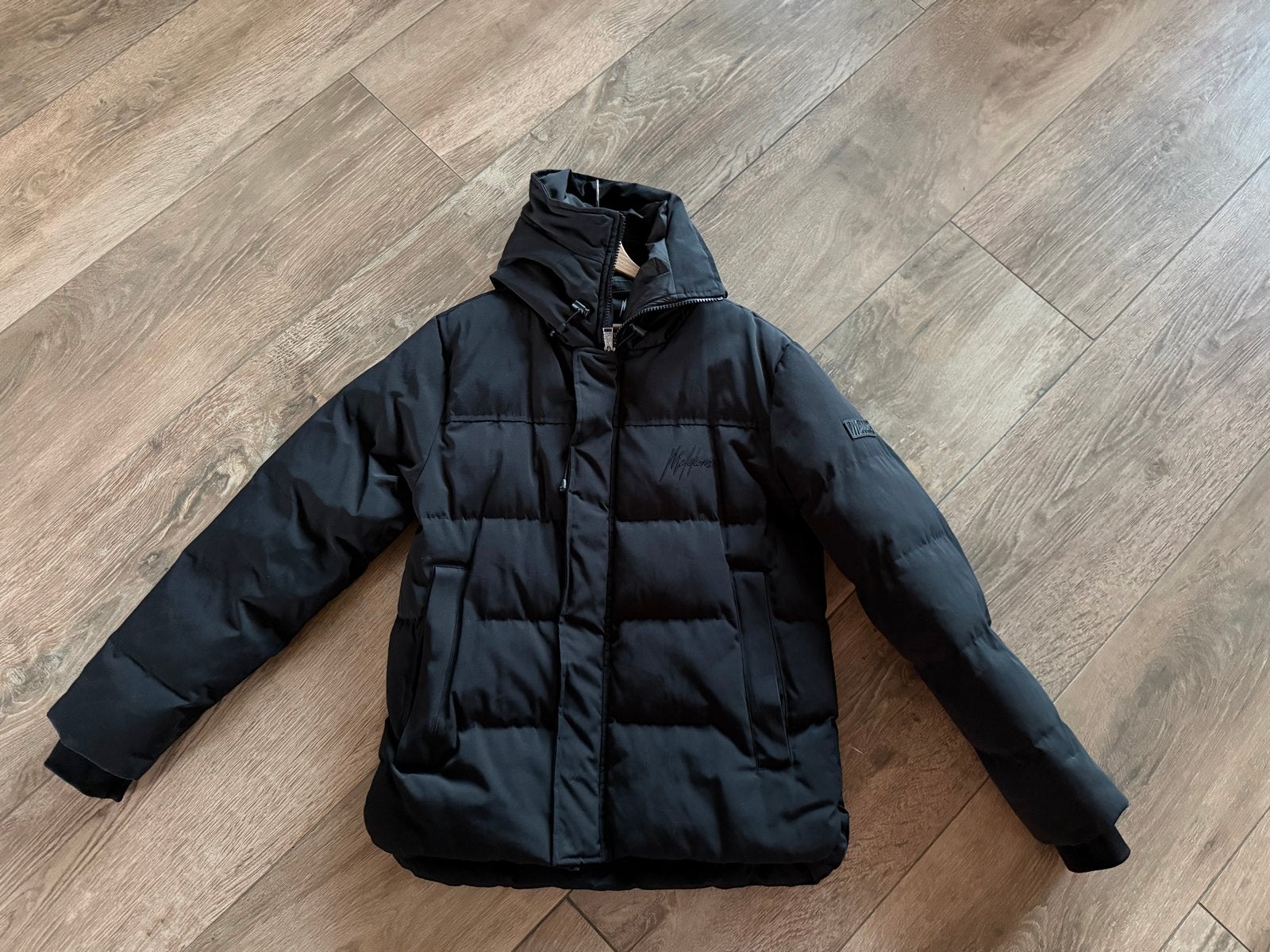 Malelions herenjas met capuchon - Maat L, Kleding | Heren, Ophalen of Verzenden, Gedragen, Maat 52/54 (L), Zwart