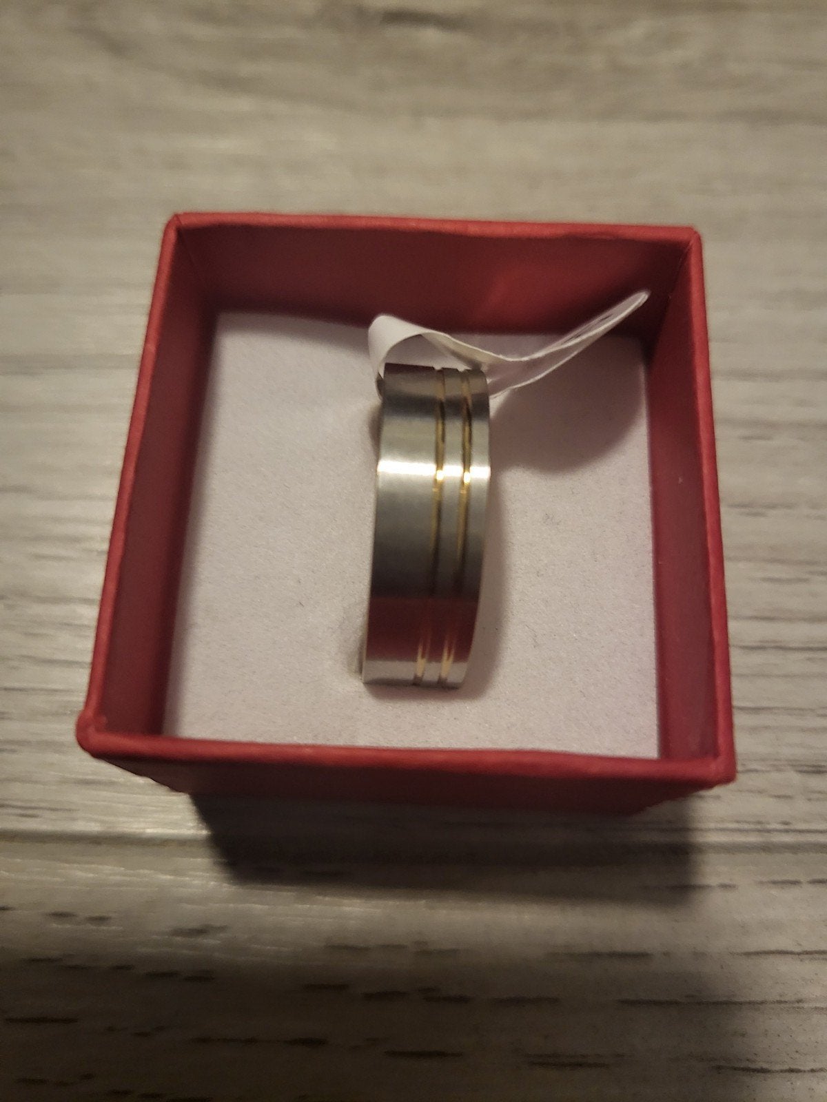 Nieuwe ring, maat 21, zilverkleurig met gouden accenten, 20 of groter, IJzer of Staal, Nieuw, Ophalen of Verzenden