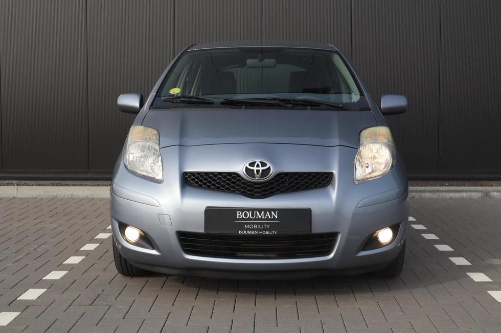 Toyota Yaris 1.3 VVTi Aspiration AUTOMAAT, CLIMATE DEALER OH, 4 cilinders, Blauw, 19 km/l, 550 kg
