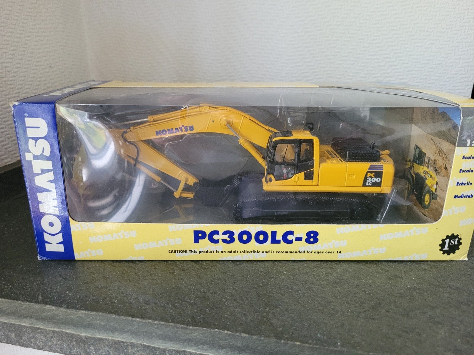 Komatsu pc 300 lc8 first gear, Hobby en Vrije tijd, Modelauto's | 1:50, Ophalen of Verzenden, Zo goed als nieuw, Bus of Vrachtwagen