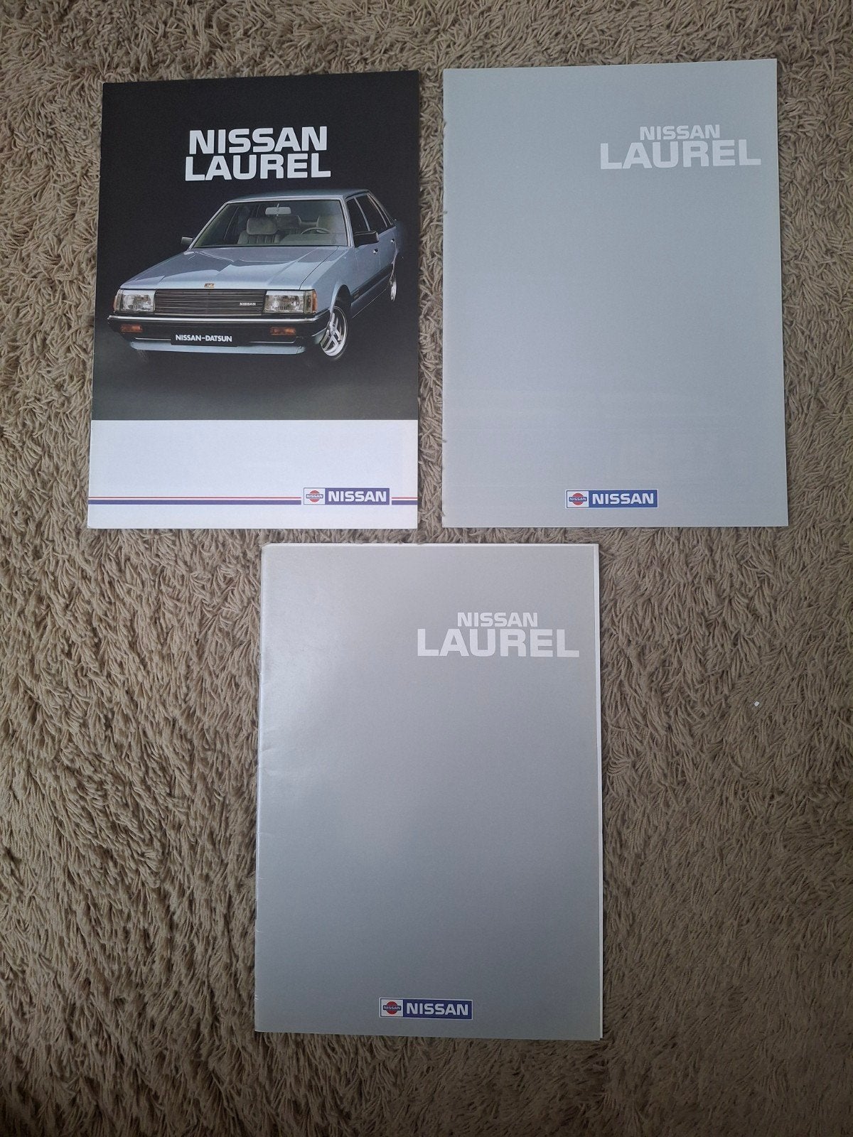 3x autofolder Nissan Laurel, Verzenden, Nissan