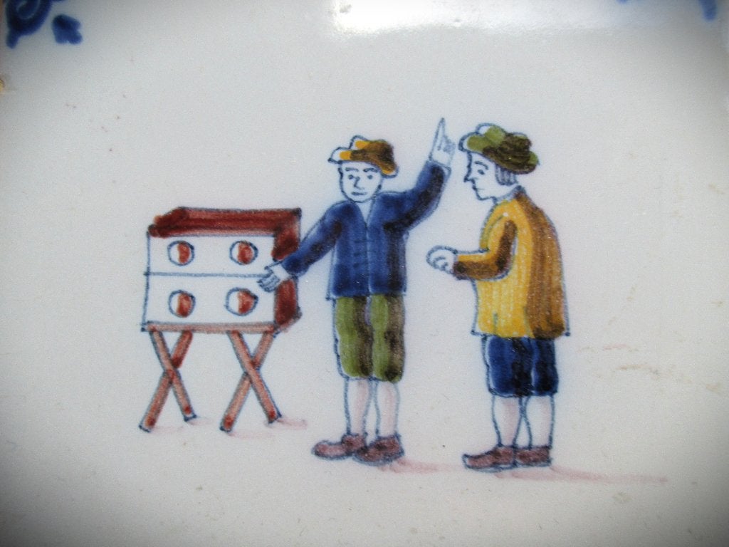 Tegel Makkum Tichelaar~Kinderspelen~Toverdoos~10 cm x 10 cm, Antiek en Kunst, Antiek | Wandborden en Tegels, Ophalen of Verzenden