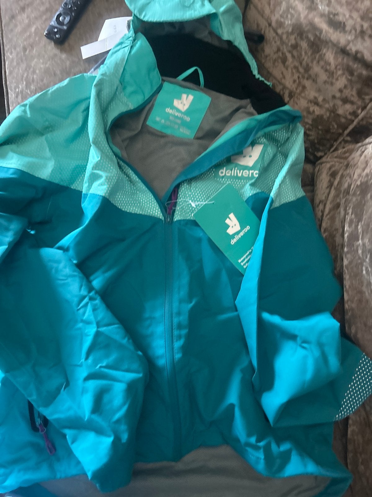 Deliveroo regenjas - Maat L - Nieuw, Verzenden, Nieuw, Maat 52/54 (L), Meerkleurig