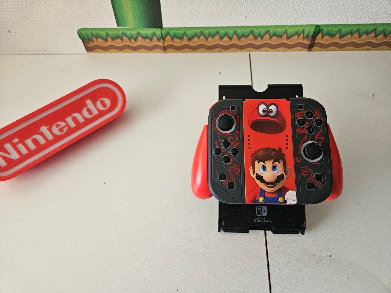 Nintendo Switch Joy-Cons (Mario Odyssey) met houder, Ophalen of Verzenden, X, X, X