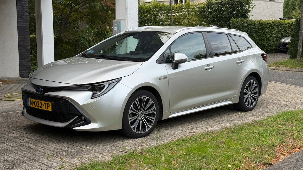Toyota Corolla TS 1.8 Hybrid 122pk CVT 2020 Grijs, Auto's, Dealer onderhouden, 4 cilinders, 98 pk, Stationwagon