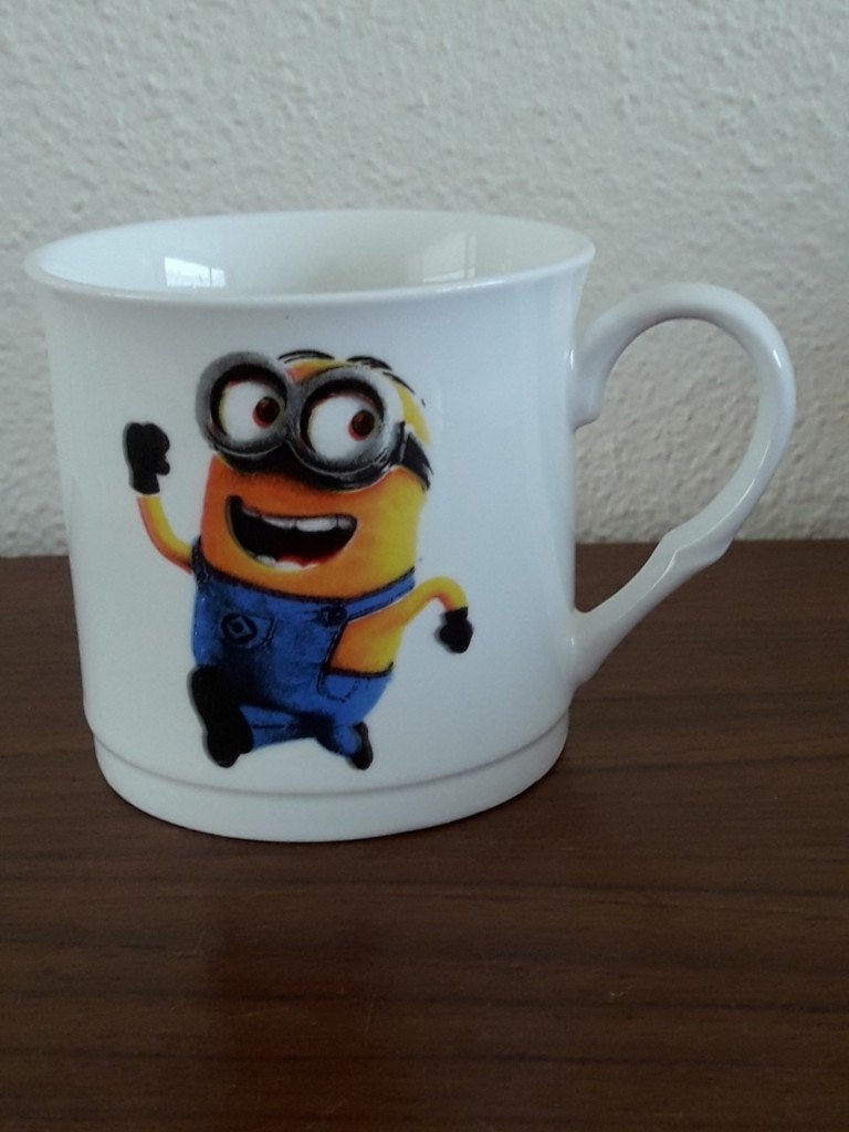 mok / koffiekop Minion , nieuw, Nieuw, Ophalen of Verzenden, Overige stijlen, Kop(pen) en/of Schotel(s)