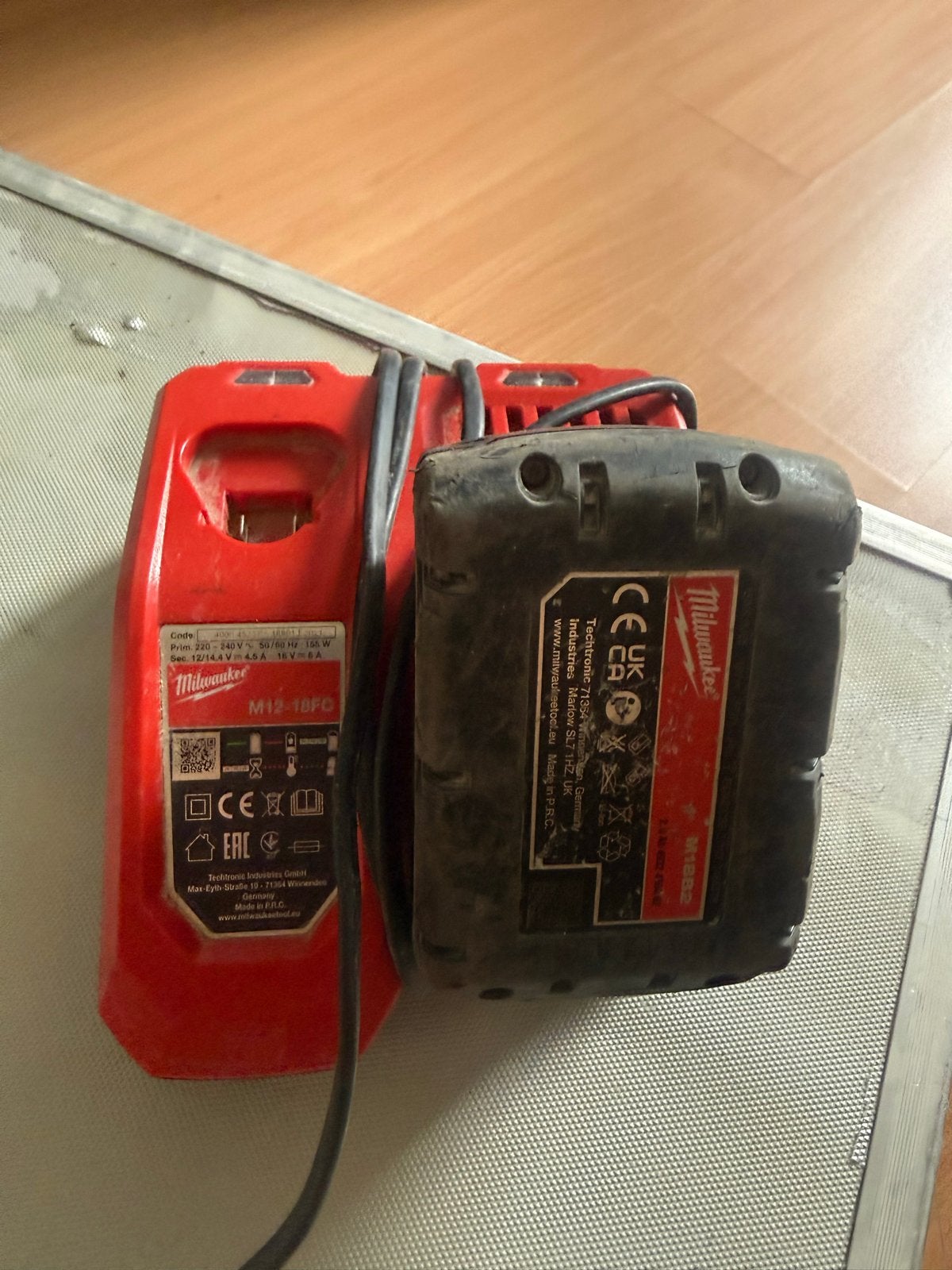 Milwaukee M12-18FC Oplader met M18 Accu, Ophalen of Verzenden, Gebruikt