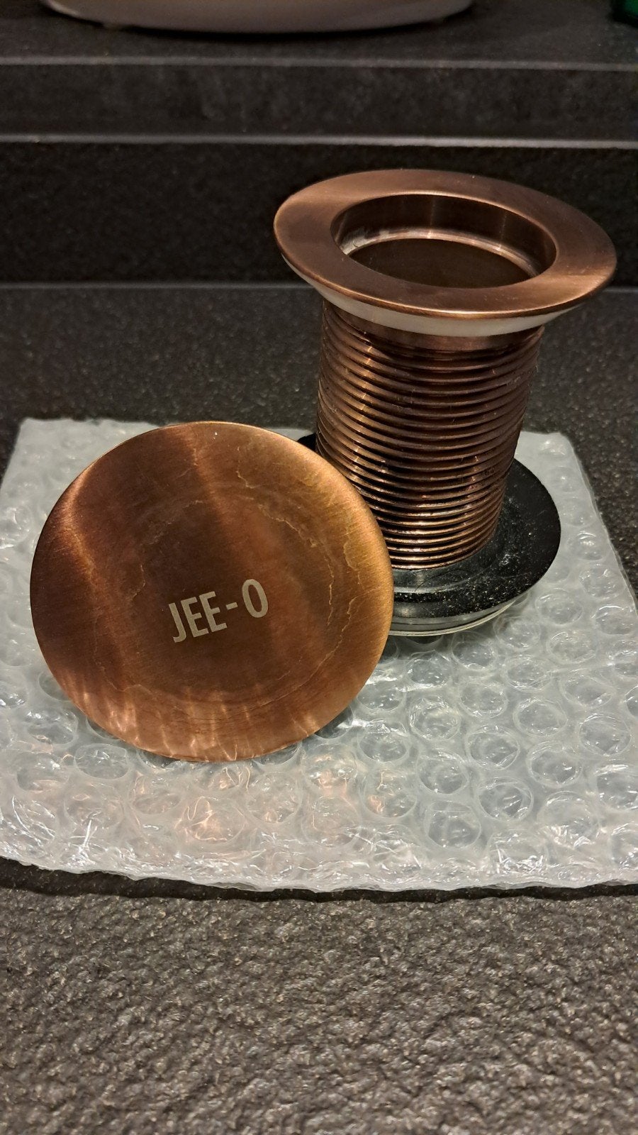 Jee-O bronzen wastafelplug - Zo goed als nieuw, Ophalen of Verzenden, Zo goed als nieuw, Koper, Wastafel