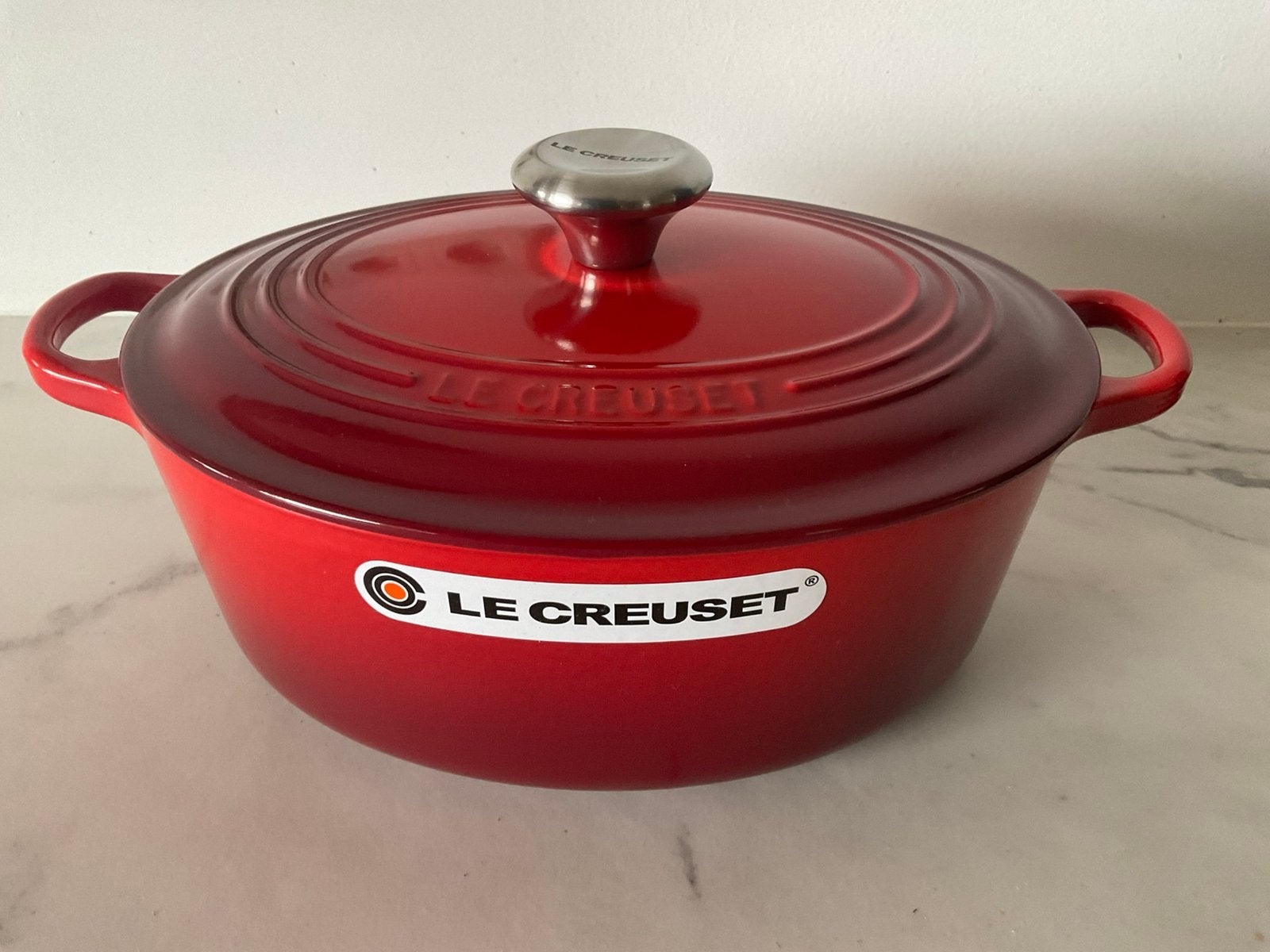 Le creuset 27 cm ovale pan, 4,1 lt, kersenrood, nieuw, Nieuw, Le Creuset, Ophalen of Verzenden, Met deksel