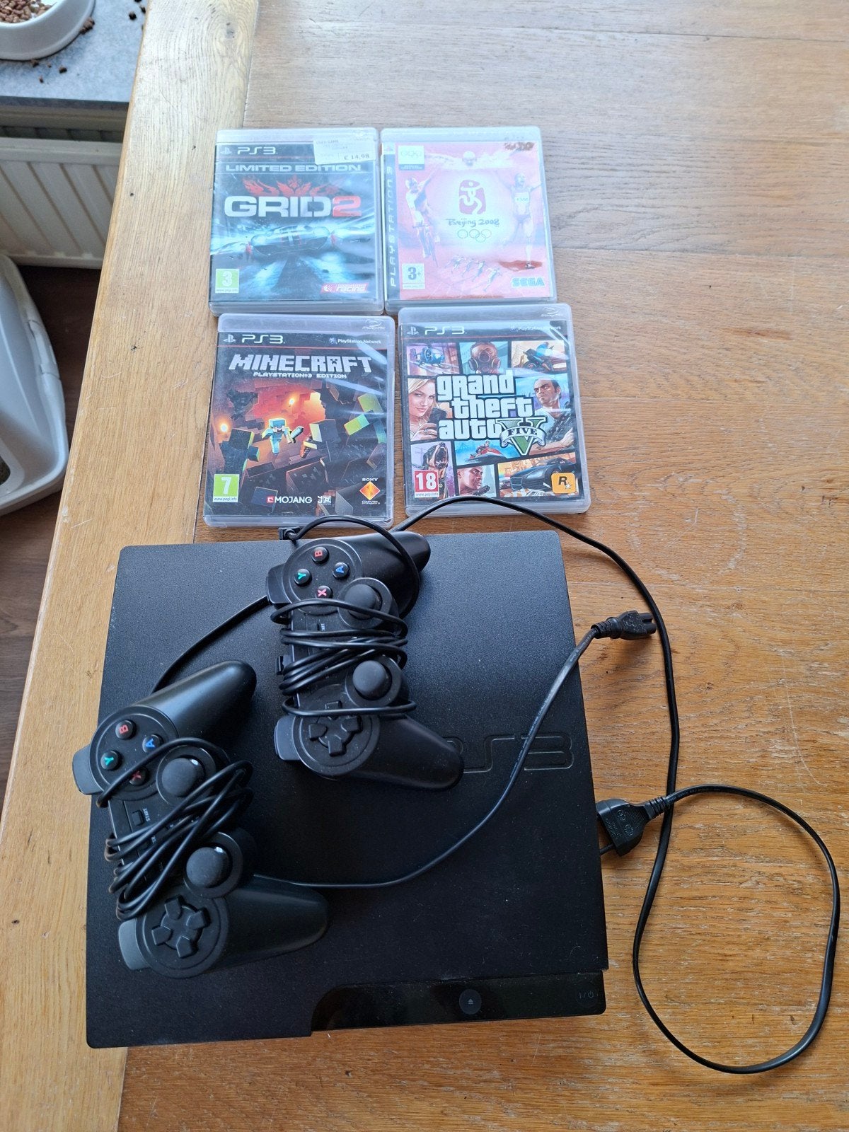 PlayStation 3 Slim met 2 controllers en 4 games, Spelcomputers en Games, Spelcomputers | Sony PlayStation 3, Ophalen, Met 2 controllers