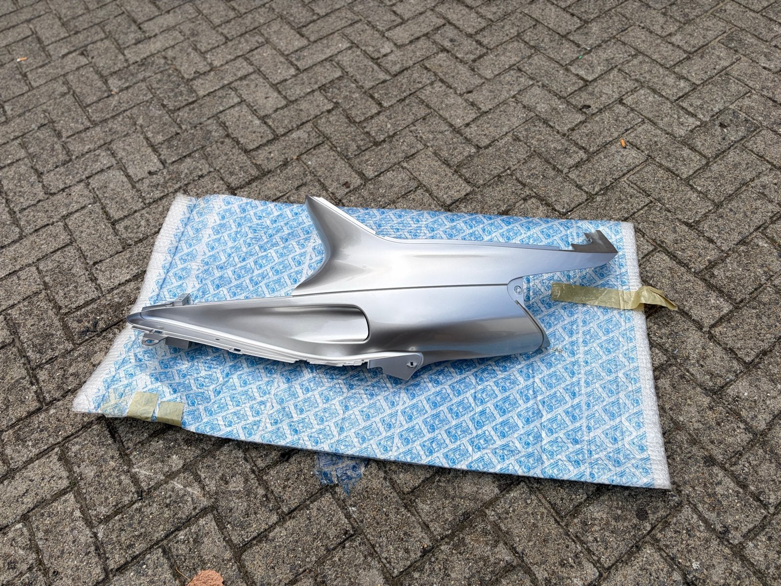 Piaggio Skipper NOS Nieuwe Links Achter Zij Kap Zilver, Ophalen of Verzenden, Nieuw, Kap, Piaggio