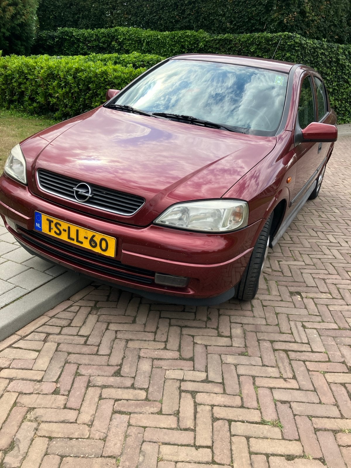 Opel Astra 1.6 I 16V AUT 1998 Rood, Auto's, 4 cilinders, 100 pk, 49 €/maand, Origineel Nederlands