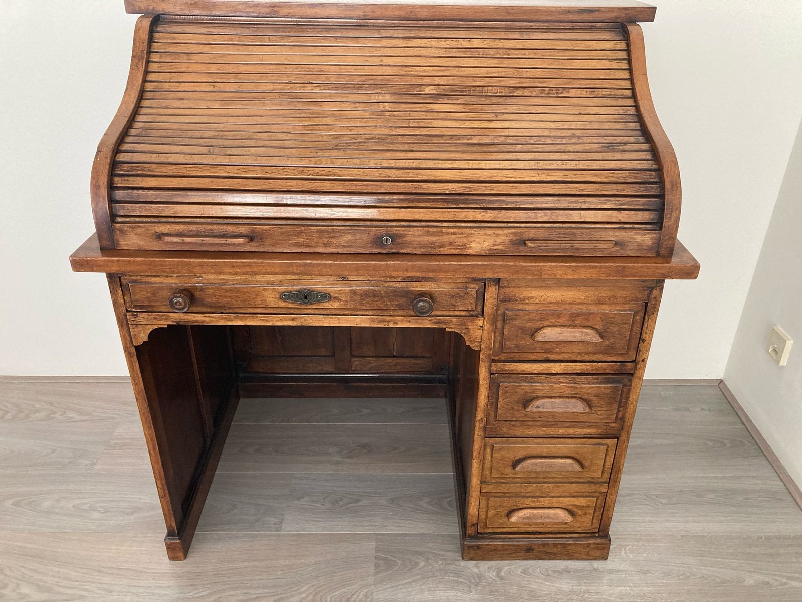Antiek rolluik bureau, Ophalen