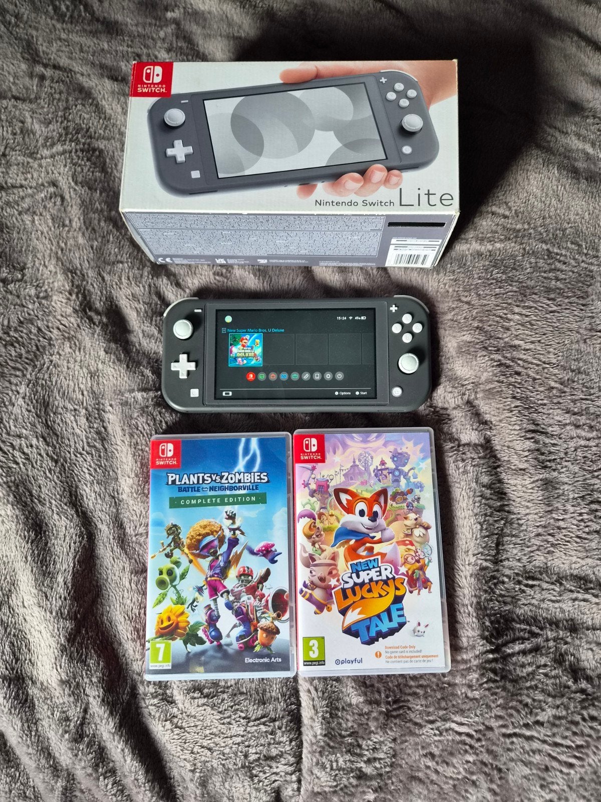 Nintendo Switch Lite Grijs met 2 spellen, Ophalen of Verzenden, Grijs, Zo goed als nieuw, Met beschermhoes of tas