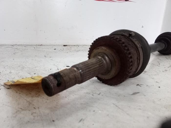 Aandrijfas links-voor van een Nissan Almera Tino, Auto-onderdelen, Gebruikt, -, -, Ophalen of Verzenden