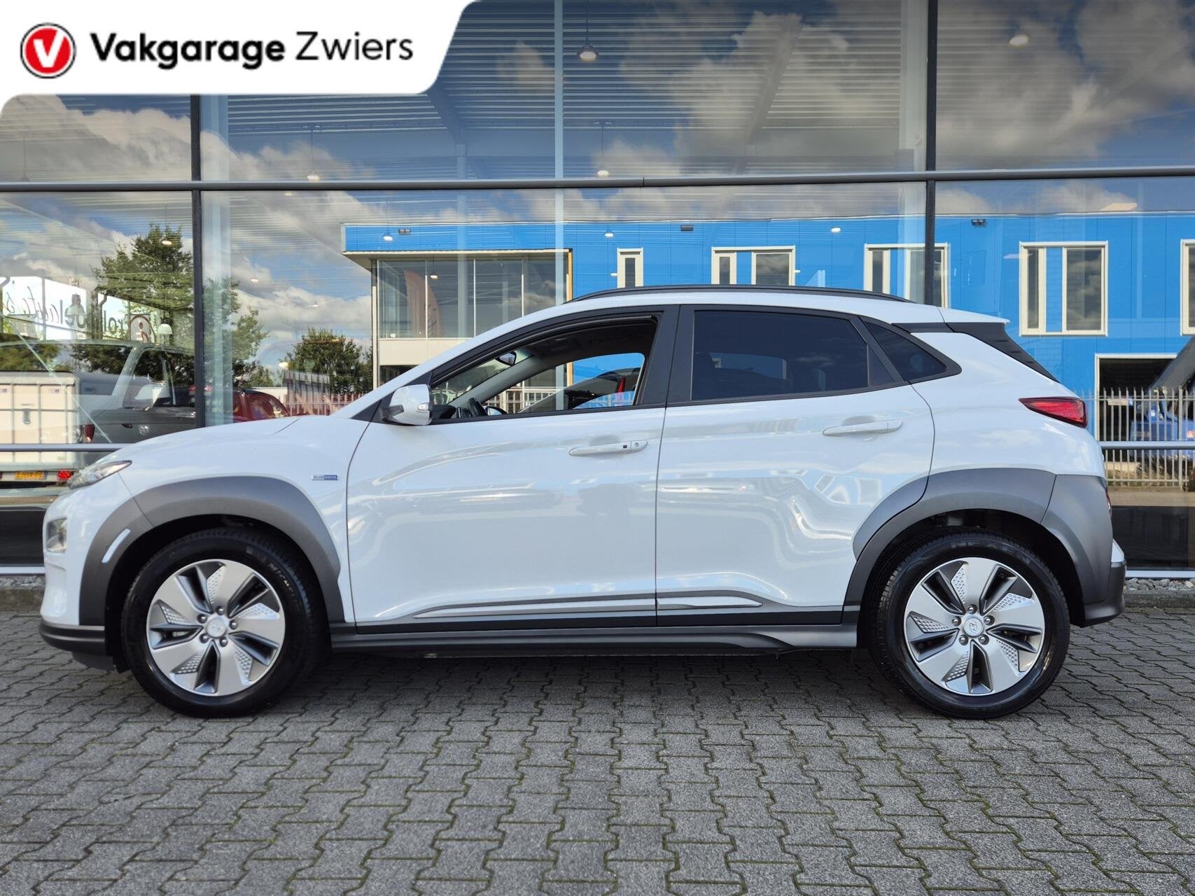 Hyundai Kona EV Premium 64 kWh|SOH 95% |Warmtepomp | Navi| H, Auto's, Gebruikt, Wit, 64 kWh, SUV of Terreinwagen