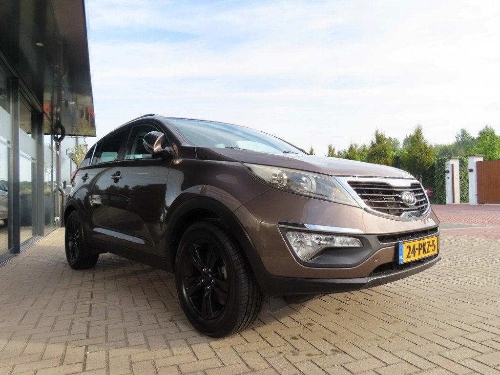 Kia SPORTAGE 2.0 X-ECUTIVE Plus Ecc Cruise Pano Trekhaak 201, Auto's, 13 km/l, Gebruikt, 4 cilinders, Bruin