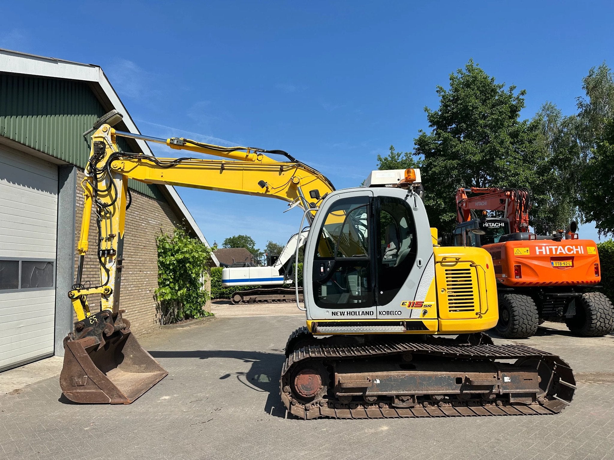 New Holland E115SR-1ES (bj 2005), Zakelijke goederen, Machines en Bouw | Kranen en Graafmachines, Graafmachine
