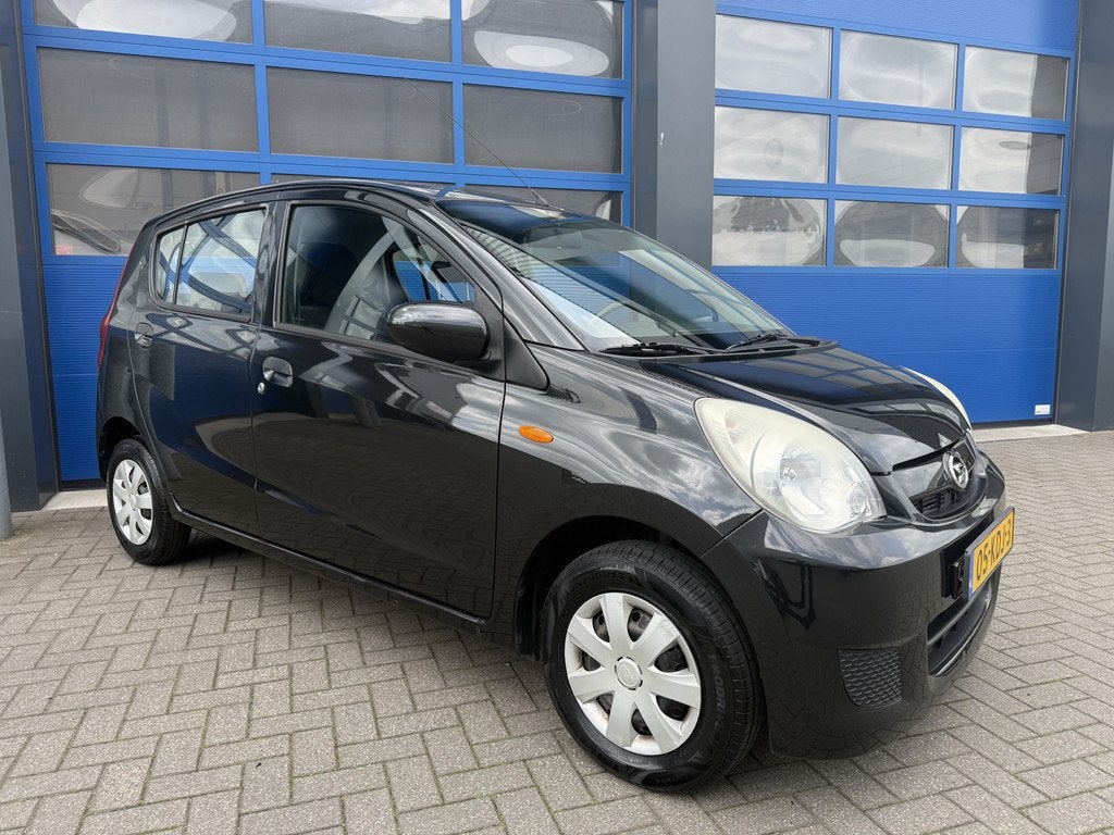 Daihatsu Cuore 1.0 69pK Airco/ BT Radio/ Comfort (bj 2009), Auto's, Daihatsu, Voorwielaandrijving, Stof, Huisgarantie, 18 €/maand