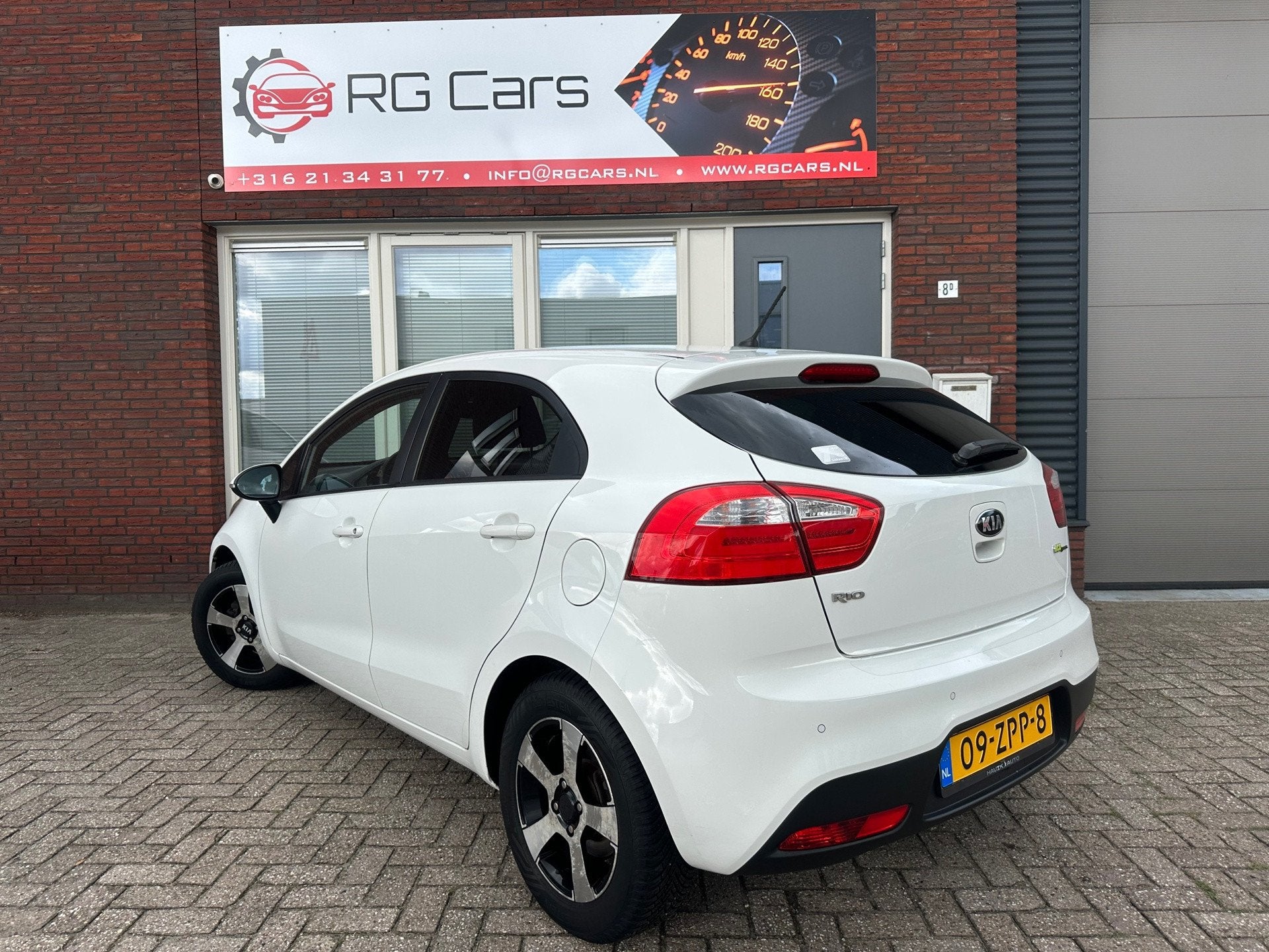 Kia Rio 1.2 CVVT Design Edition / Airco / Cruise / PDC / LM, Euro 5, 4 cilinders, Met garantie (alle), Wit