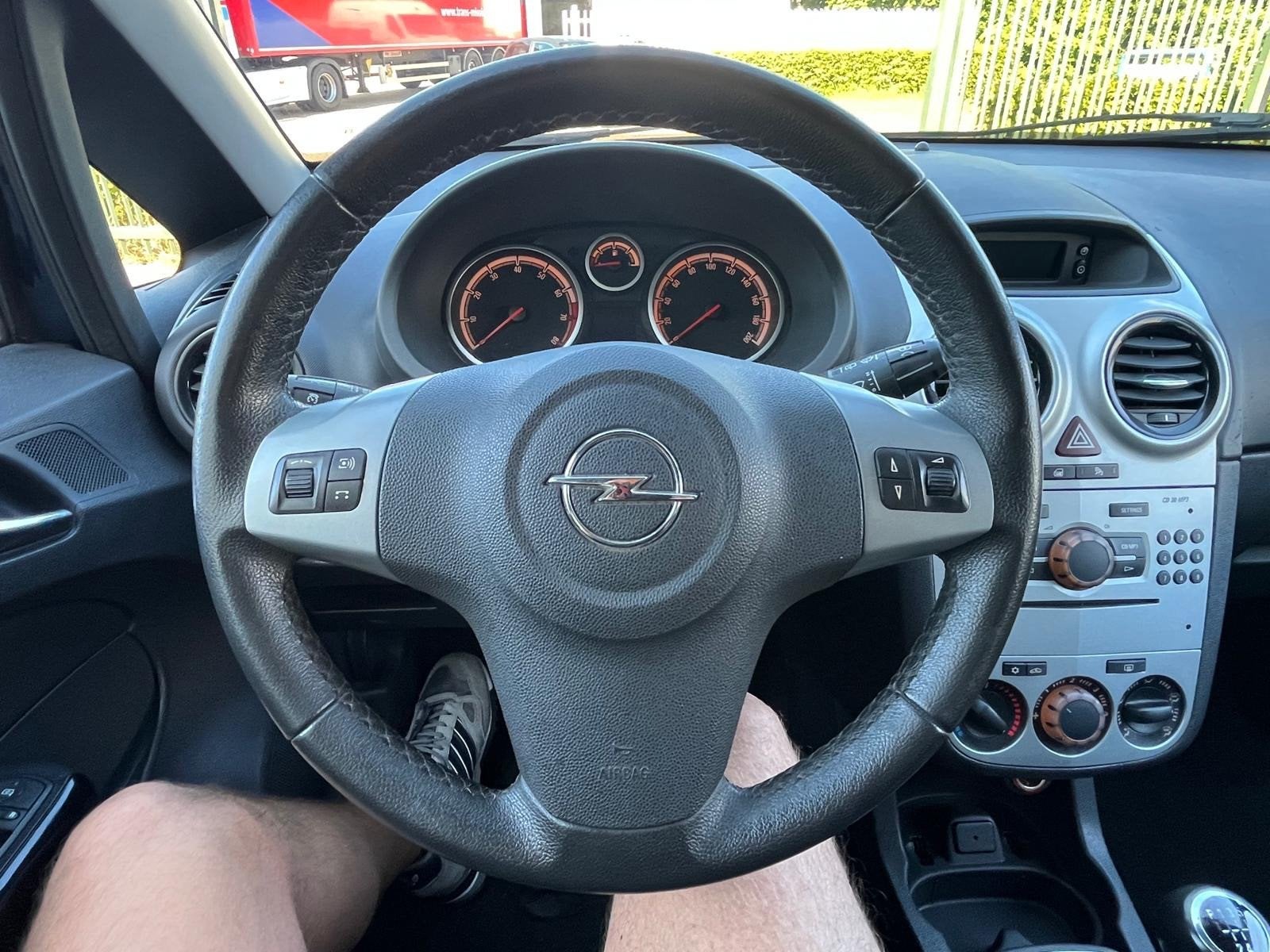 Opel Corsa 1.2-16V Design Edition, Auto's, Gebruikt, Zwart, 4 cilinders, Blauw