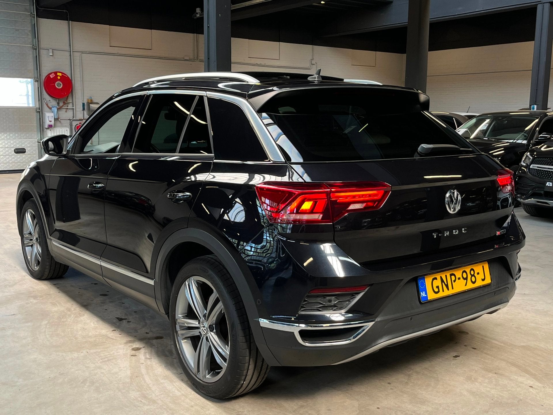 Volkswagen T-ROC 2.0 TSI 4Motion Sport Pano/Carplay/ACC/Stuu, Auto's, Automaat, Dealer onderhouden, 15 km/l, Gebruikt