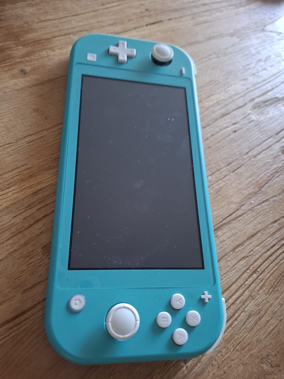 Nintendo Switch Lite Turquoise met 4 games en hoes, Ophalen, Met games, Zo goed als nieuw, Zonder controller