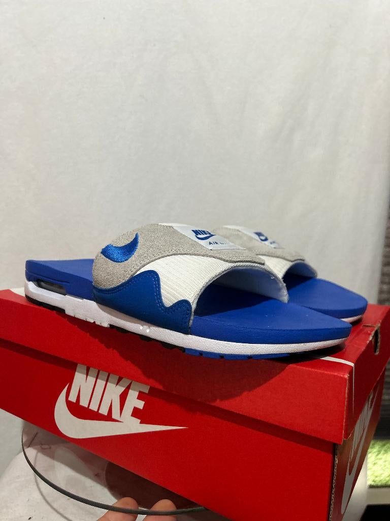 ALS NIEUW + DOOS Maat 49,5 - Nike Air Max 1 Slide Royal Blue, Slippers, Verzenden, Wit, Nike