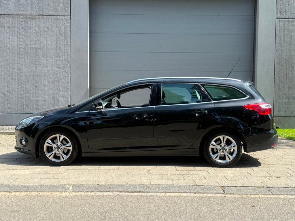 Ford Focus Wagon 1.0 EcoBoost Titanium, Auto's, Euro 5, 125 pk, Gebruikt, Zwart