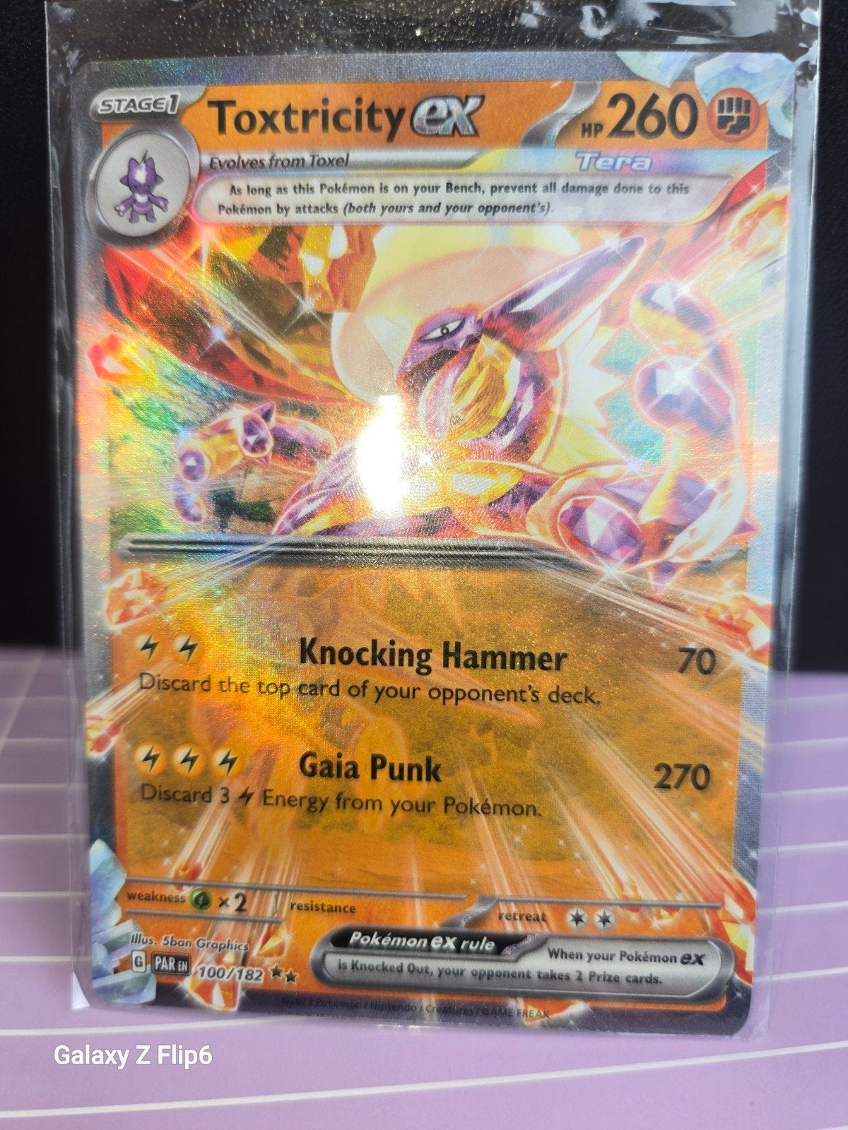 Toxtricity ex Tera Pokémon kaart 100/182 Foil, Ophalen of Verzenden, Zo goed als nieuw, Losse kaart, Foil
