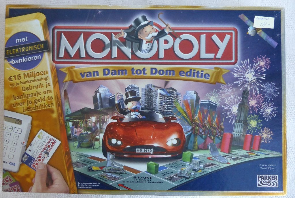 Monopoly Van Dam tot Dom editie, Hobby en Vrije tijd, Gezelschapsspellen | Bordspellen, Vijf spelers of meer, Ophalen of Verzenden