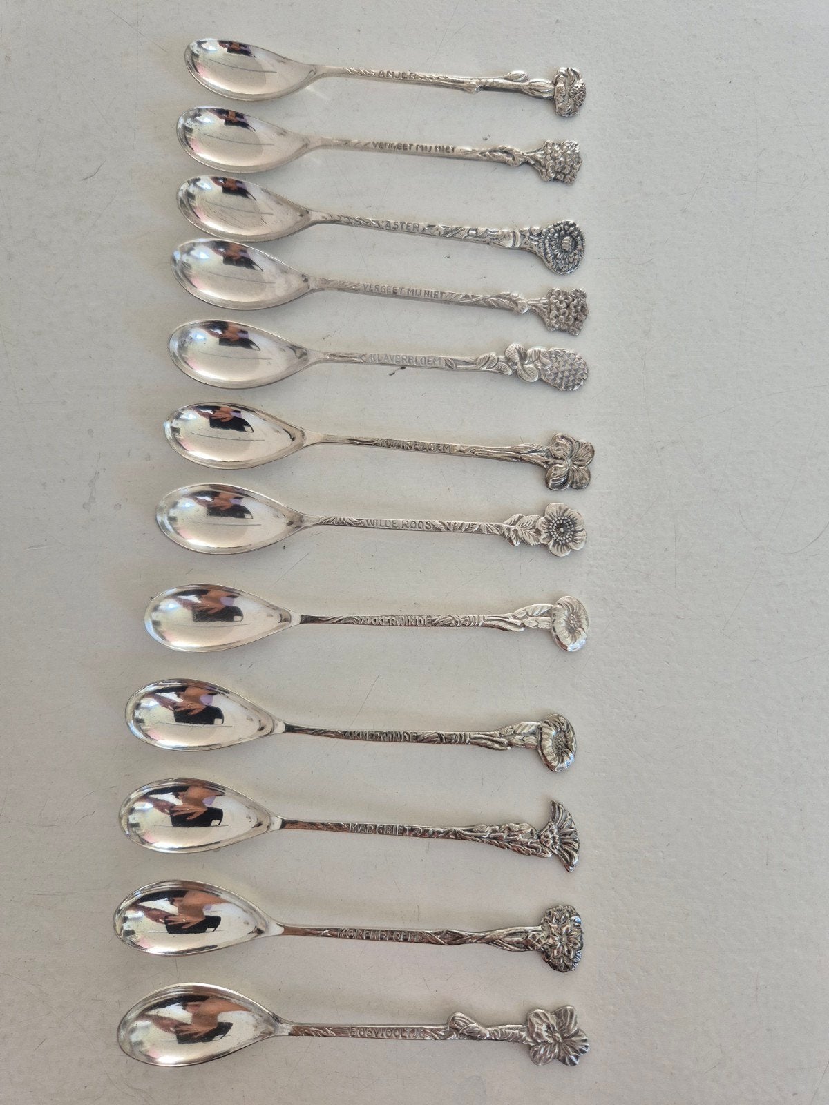 Set van 10 antieke verzilverde theelepels met bloemmotief, Antiek en Kunst, Antiek | Bestek, Ophalen of Verzenden